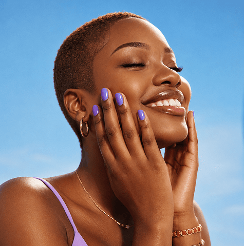 Woman in a lilac top smiling